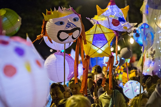 Lanterns fill the street as people march toward Decatur Square during the Decatur Lantern Parade. Photo: Jonathan Phillips