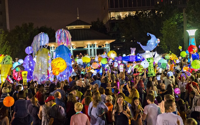 Thousands of people listen to the Black Sheep Ensemble play in Decatur Square at the conclusion of the Decatur Lantern Parade. Photo: Jonathan Phillips