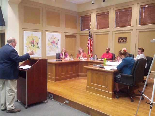 Local attorney Robert Wayne asks Decatur Planning Commissioners to block a proposed housing development that would bulldoze Oakhurst Dog Park. Photo by Carey O'Neil