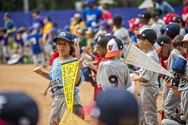 Players gear up for their games as the ceremony for the opening day of Decatur Youth Baseball comes to a close at Oakhurst Park. Photo: Jonathan Phillips