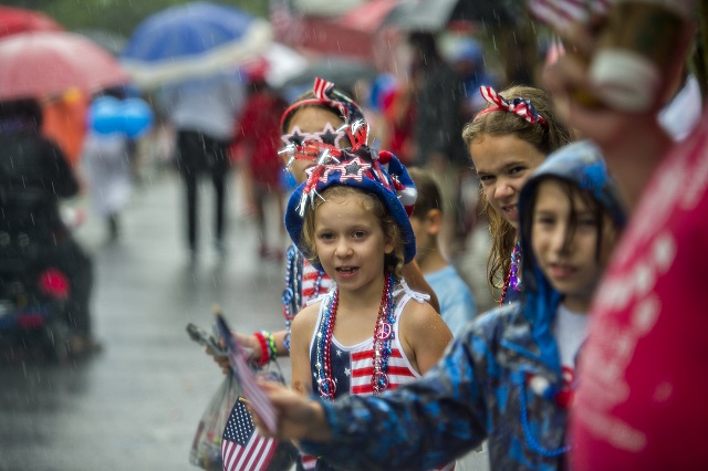 Rain doesn't stop people from coming out to watch the Avondale Estates 4th of July Parade on Saturday. Photo: Jonathan Phillips