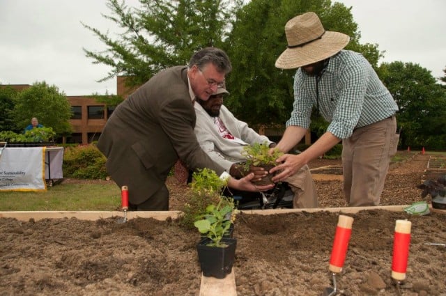 Former Georgia Perimeter College president Anthony Tricoli and Tyrie Smith, a former GPC employee, work in the GPC community garden in Decatur. Photo provided by Tyrie Smith