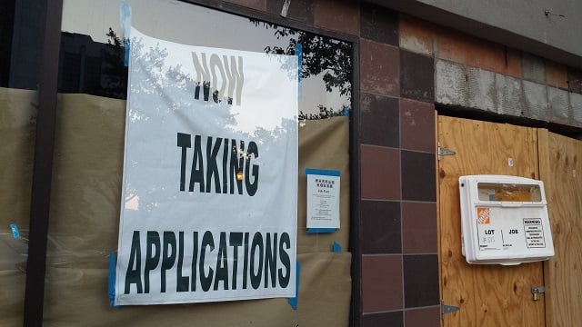 A sign on the door of the Decatur Waffle House, currently under construction. Photo by Dena Mellick