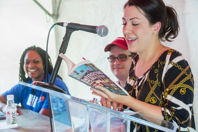 Dena Mellick (right) reads a selection from Decaturish's columnist Nicki Salcedo's new book Intersections during the Decatur Book Festival on Saturday. Photo: Jonathan Phillips