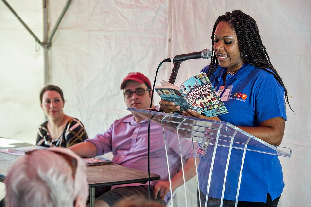 Flanked by Decaturish's Dena Mellick (left) and Dan Whisenhunt, columnist Nicki Salcedo (right) reads a selection from her new book Intersections during the Decatur Book Festival on Saturday. Photo: Jonathan Phillips