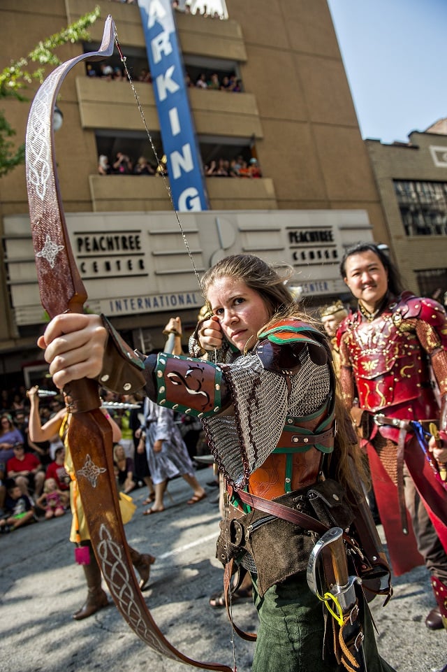 Abigail Singer plays up to the crowd during the annual DragonCon Parade in Atlanta on Saturday. Photo: Jonathan Phillips