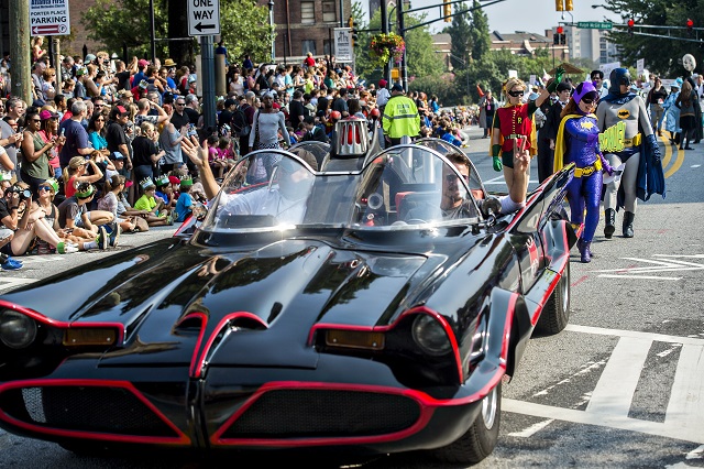 Dressed as Batgirl, Jennifer Rineskso follows the Batmobile down Peachtree St. in Atlanta during the annual DragonCon Parade on Saturday. Photo: Jonathan Phillips
