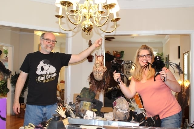 David Mitchell and Jennifer Jones-Mitchell sort out Halloween decorations. They say it normally takes them about six weeks to fully decorate their home for the spooky holiday. Photo by Dena Mellick