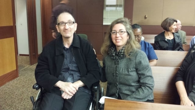 Greg Germani with girlfriend Beth Harrill in Fulton County Superior Court Tuesday. Photo by Dena Mellick