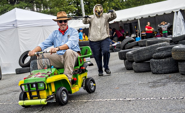 Jay Dellinger (left) is chased by Selena Fulford as they compete in the Moxie Challenge during the Atlanta Maker Faire in Decatur on Saturday.  Photo: Jonathan Phillips