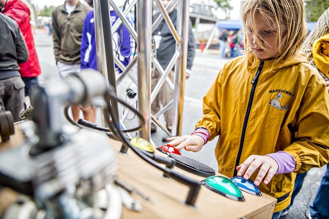 Charlotte Fee plays a homemade game of Simon during the Atlanta Maker Faire in Decatur on Saturday. Photo: Jonathan Phillips