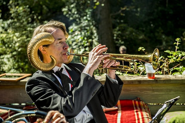 Bo Emerson plays the trumpet with Weapons of Brass Destruction during the Oakhurst Porch Fest on Sunday. Photo: Jonathan Phillips