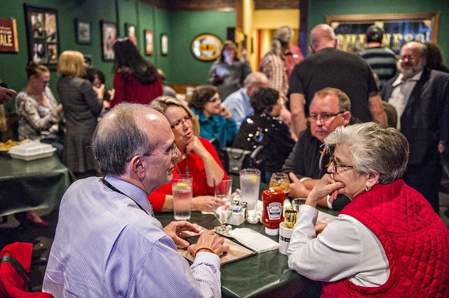 Mary Lindsey Lewis (right) talks with fellow supporters of Dekalb Strong during their viewing party at Melton's app & tap on Tuesday. Photo: Jonathan Phillips