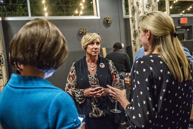 Mary Kay Woodworth talks with fellow supporters during the Lavista Hills viewing party at Sprig on Tuesday. Photo: Jonathan Phillips