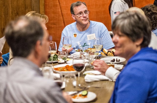 Allen Venet (center) talks with fellow supporters during the Lavista Hills viewing party at Sprig on Tuesday. Photo: Jonathan Phillips