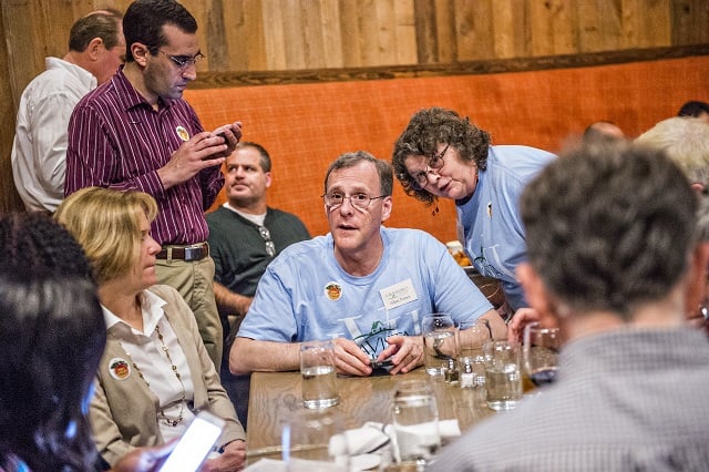 Allen Venet (center) talks with Amy Parker during the Lavista Hills viewing party at Sprigs on Tuesday. Photo: Jonathan Phillips