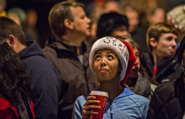 Stella Esposito-Gooden glances towards the Christmas tree in downtown Decatur during the annual lighting of the tree celebration on Thursday. Photo: Jonathan Phillips
