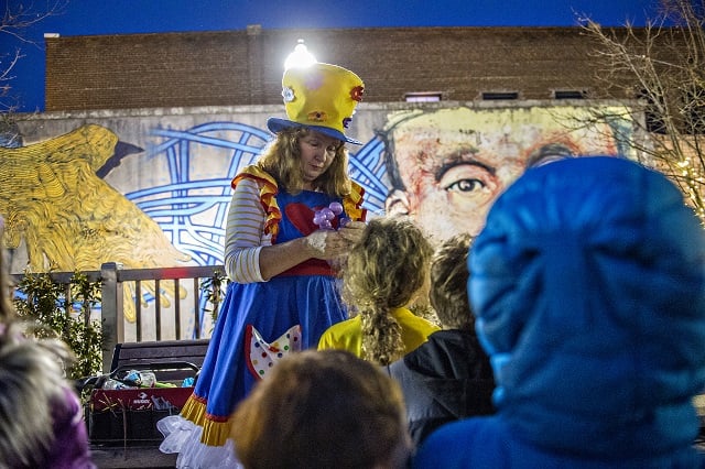 Twinkle Star the Clown makes balloon animals during the Chanukah celebration in Decatur Square on Thursday. Photo: Jonathan Phillips