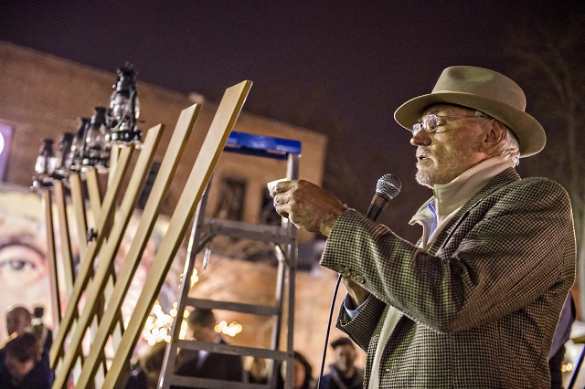 Mayor Jim Baskett speaks to the crowd during the Chanukah celebration in Decatur Square on Thursday. Photo: Jonathan Phillips