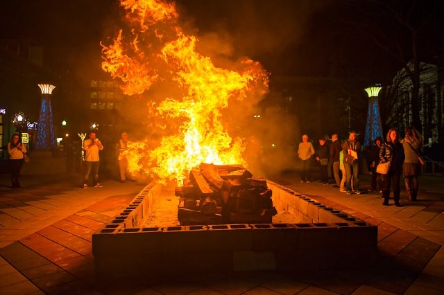 The large bonfire starts to burn at the start of the annual marshmallow roast at Decatur Square on Thursday. Photo: Jonathan Phillips