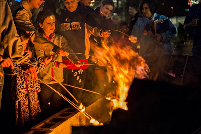 Genevieve Uhlenbrock (left) holds onto her stick during the annual marshmallow roast at Decatur Square on Thursday. Photo: Jonathan Phillips