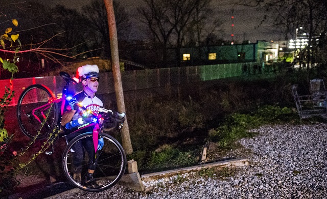 Pete Wicker climbs up the hill to Atlanta Beltline Bicycles as he gathers with around 50 other cyclists before the annual Atlanta Christmas Ride on Wednesday evening. Photo: Jonathan Phillips