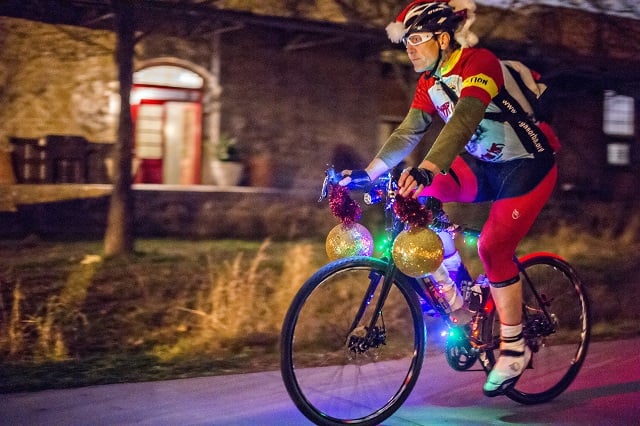William Le Master rides down the Atlanta Beltline's Eastside Trail with around 50 other cyclists during the annual Atlanta Christmas Ride on Wednesday evening. Photo: Jonathan Phillips
