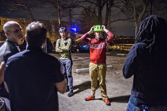 Andrew Beishline (center) checks his helmet as he gathers at Atlanta Beltline Bicycle with around 50 other cyclists before the annual Atlanta Christmas Ride on Wednesday evening. Photo: Jonathan Phillips