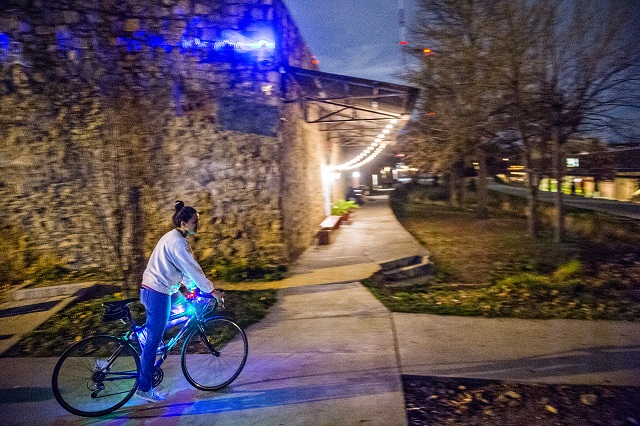 A cyclist takes off from Atlanta Beltline Bicycle to catch up with around 50 others as they participate in the annual Atlanta Christmas Ride on Wednesday evening. Photo: Jonathan Phillips