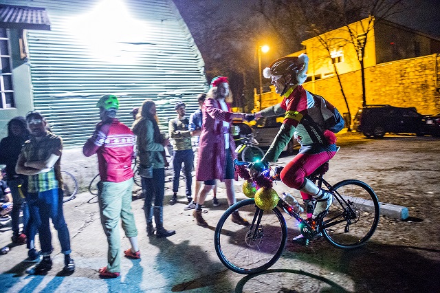 William Le Master (right) pulls up to Atlanta Beltline Bicycle with around 50 other cyclists before the annual Atlanta Christmas Ride on Wednesday evening. Photo: Jonathan Phillips
