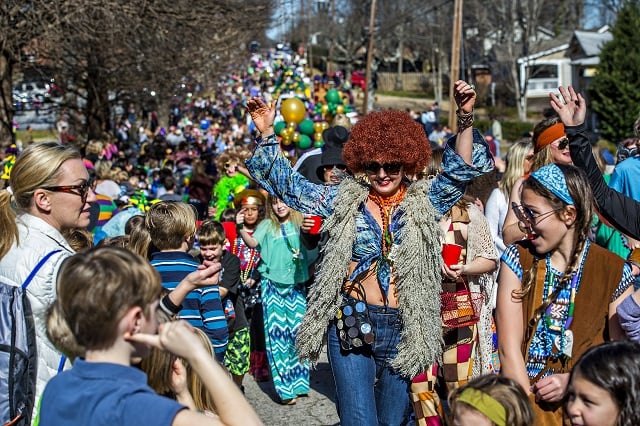 Emily Cook (center) dances down the street as she participates in first annual LantaGras Parade in Kirkwood on Saturday. Photo: Jonathan Phillips