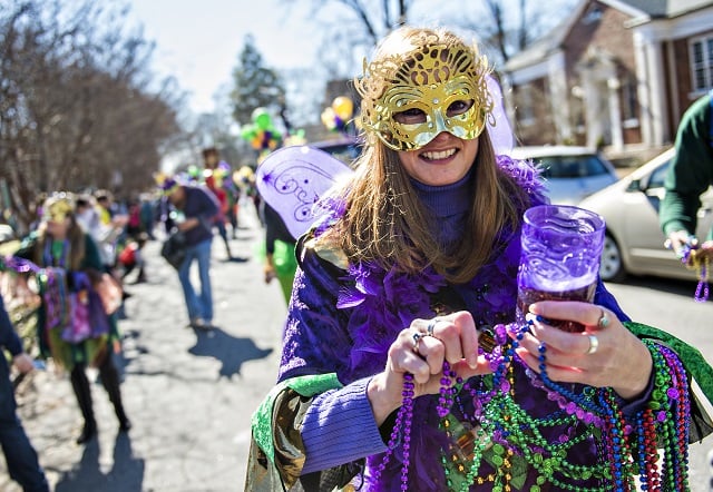 Amber Hall works to detangle a bunch of beads during the first annual LantaGras Parade in Kirkwood on Saturday. Photo: Jonathan Phillips