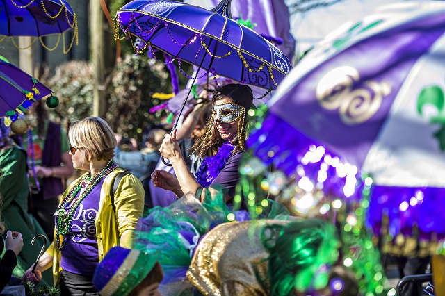 Beverly Beyer (center) takes shelter from the sun under an umbrella before the start of the first annual LantaGras Parade in Kirkwood on Saturday. Photo: Jonathan Phillips