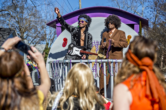 Katarro Rountree (left) and Dennis Ruffin throw beads to the crowd during the first annual LantaGras Parade in Kirkwood on Saturday. Photo: Jonathan Phillips