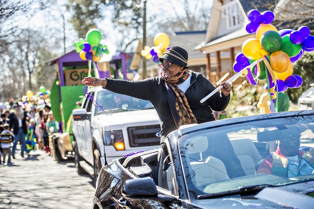 Atlanta City Council member Natalyn Mosby Archibong tosses beads to the crowd during the first annual LantaGras Parade in Kirkwood on Saturday. Photo: Jonathan Phillips