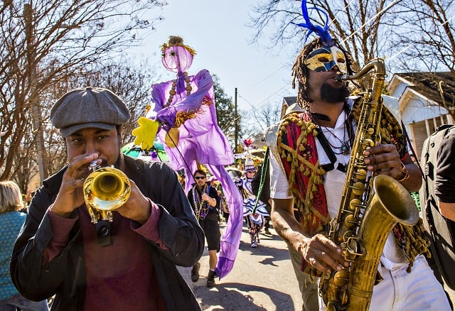 Wolfpack ATL's Dashill Smith (left) and Kebbi Williams play music as they march in the first annual LantaGras Parade in Kirkwood on Saturday. Photo: Jonathan Phillips