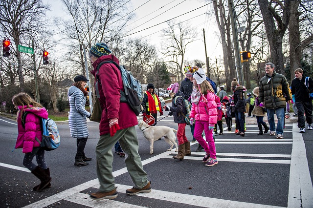 A large group of people cross S. Candler St. at Kirk Rd. in Decatur on their way to school during the Big Walk on South Candler event on Wednesday morning. Photo: Jonathan Phillips