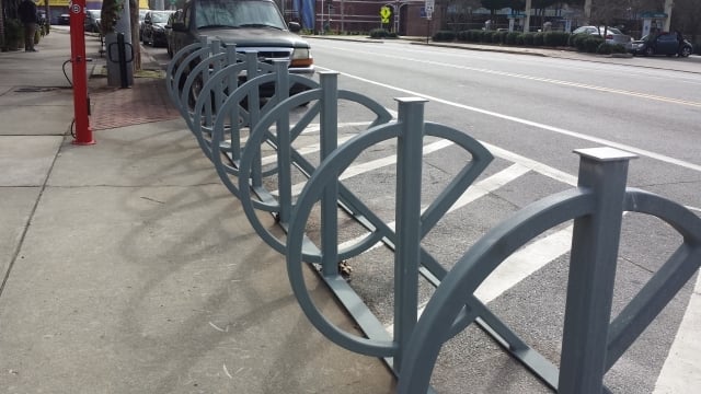 Carl Holt oversaw bringing these artistic bike racks and the Fixit Stand to downtown Kirkwood. Photo by Dena Mellick