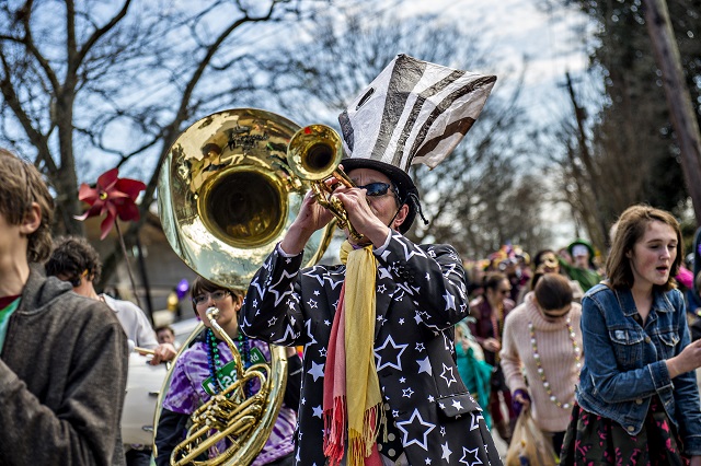 Bo Emerson (center) plays his trumpet during the Mead Rd. Mardi Gras Parade on Saturday. Photo: Jonathan Phillips