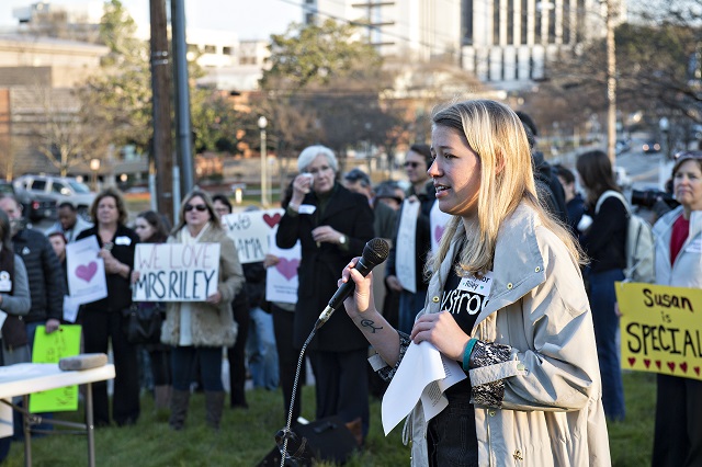 Sara Stubbs (right), one of the organizers of the Rally for Riley, speaks to the crowd gathered across from Decatur High School in support of Susan Riley on Monday morning. Photo: Jonathan Phillips