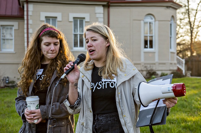 Sarah Norman (left) and Sara Stubbs, the organizers of the Rally for Riley, speak to a few hundred people gathered during the Rally for Riley across from Decatur High School on Monday morning. Photo: Jonathan Phillips