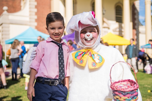 Narayan Herrera poses with the Easter Bunny before the hunt begins.