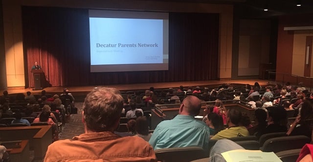 Decatur parents and community members listen Monday night at Decatur High School during a forum to discuss teenage “risky behaviors.” Photo by Mariann Martin