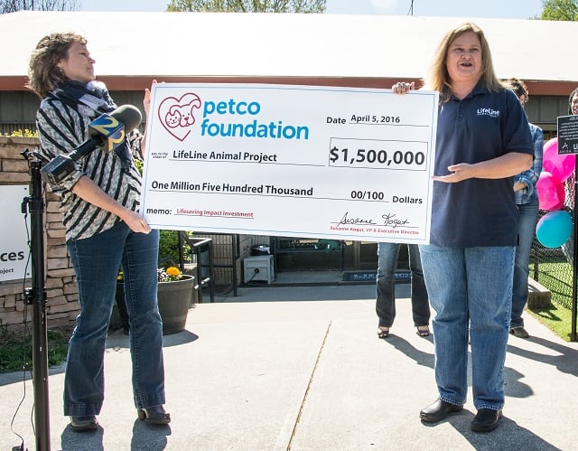 Petco Foundation Executive Director Susanne Kogut presents check to LifeLine Animal Project Founder and CEO Rebecca Guinn. Photo provided to Decaturish 