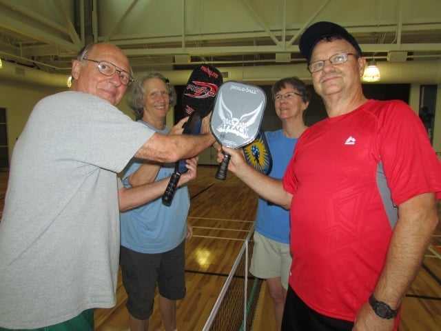 Pickleball players in Decatur hold up their paddles. Photo courtesy of Decatur Active Living/Travis Hudgons