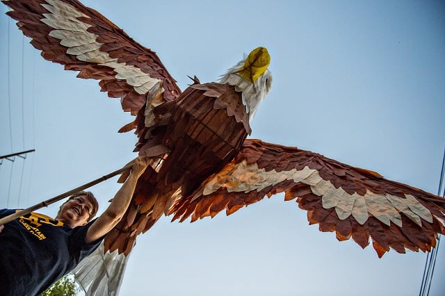 Dianna Watson (left) holds an eagle lantern as she waits for the start of the third annual Decatur Lantern Parade on Friday. Photo: Jonathan Phillips