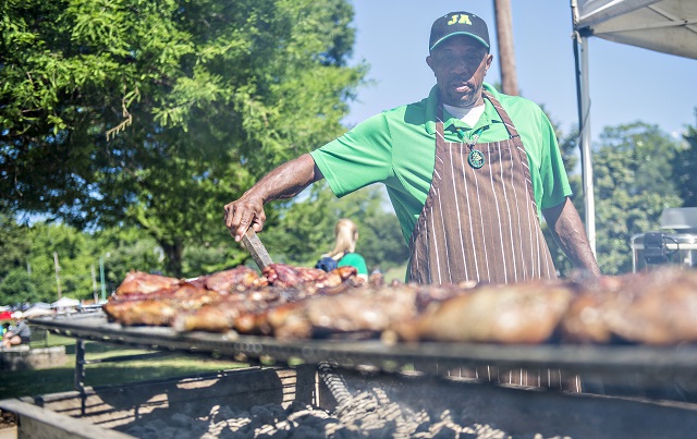 Alva Bramwell tends to a grill full of chicken during the Kirkwood Spring Fling on Saturday. Photo: Jonathan Phillips