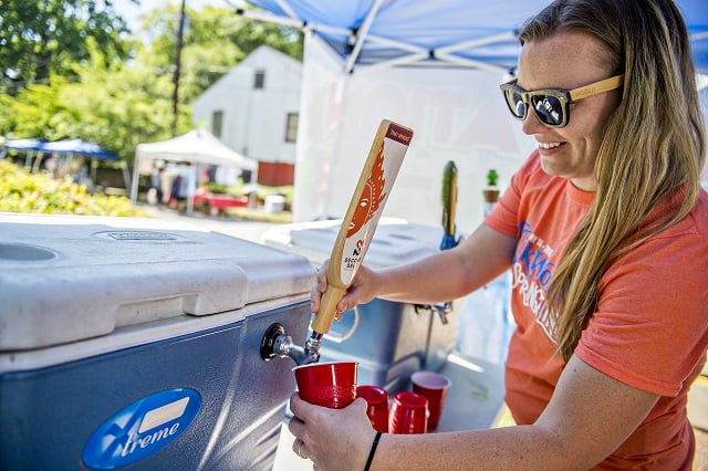 Meredith Hill pours a beer for a thirsty customer during the Kirkwood Spring Fling on Saturday. Photo: Jonathan Phillips