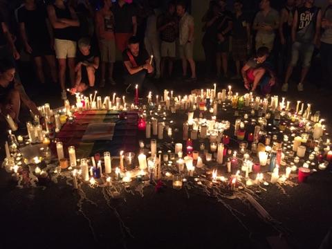 Mourners held a vigil at 10th Street and Piedmont Avenue in Midtown to honor the victims of the June 12 massacre in Orlando. Photo by Lisa Nanette Allender, provided courtesy of Atlanta INtown.
