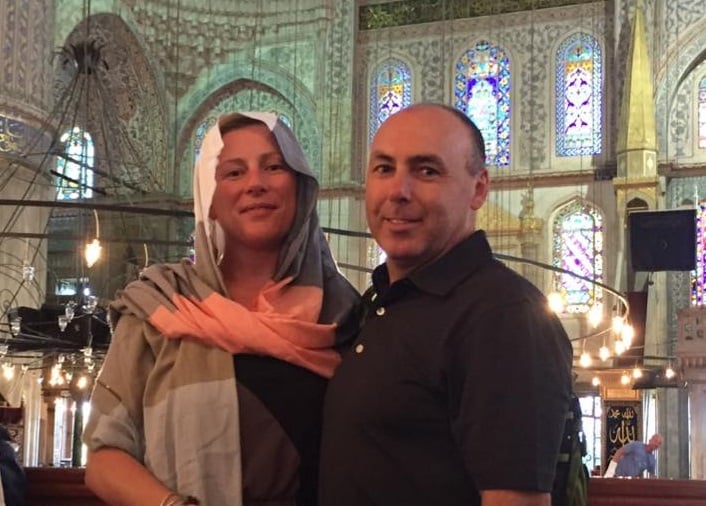 Meaghan Flood and Carl Newton posing for a photo at a Mosque in Turkey. Photo provided to Decaturish